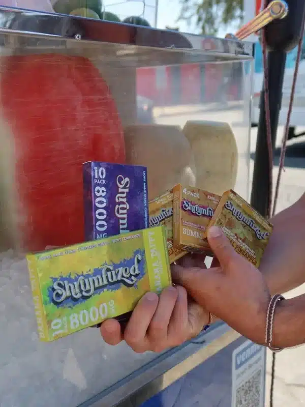 Shrumfuzed gummies product packaging featuring available flavors and formats